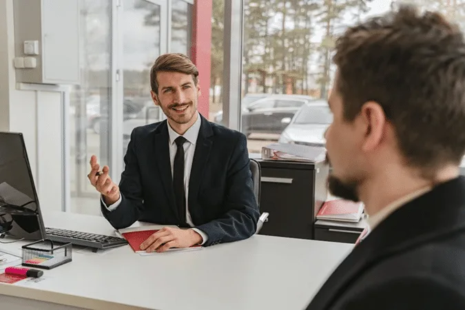 Two men in a meeting discussing the enforcer’s role in non-charitable purpose trusts and Cayman Island STAR Trusts.
