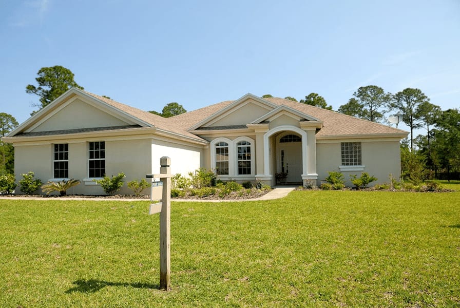 Suburban home illustrating asset protection in international estate planning context.